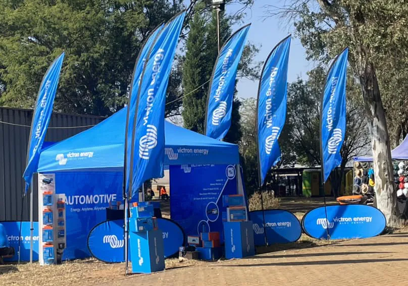 An event setup including multiple teardrop banners and a gazebo for Victron Energy.